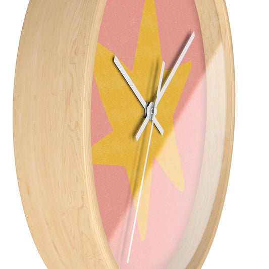 Round bamboo wall clock with hand-painted yellow star on a soft pink background and white clock hands, perfect for nursery or playroom decor