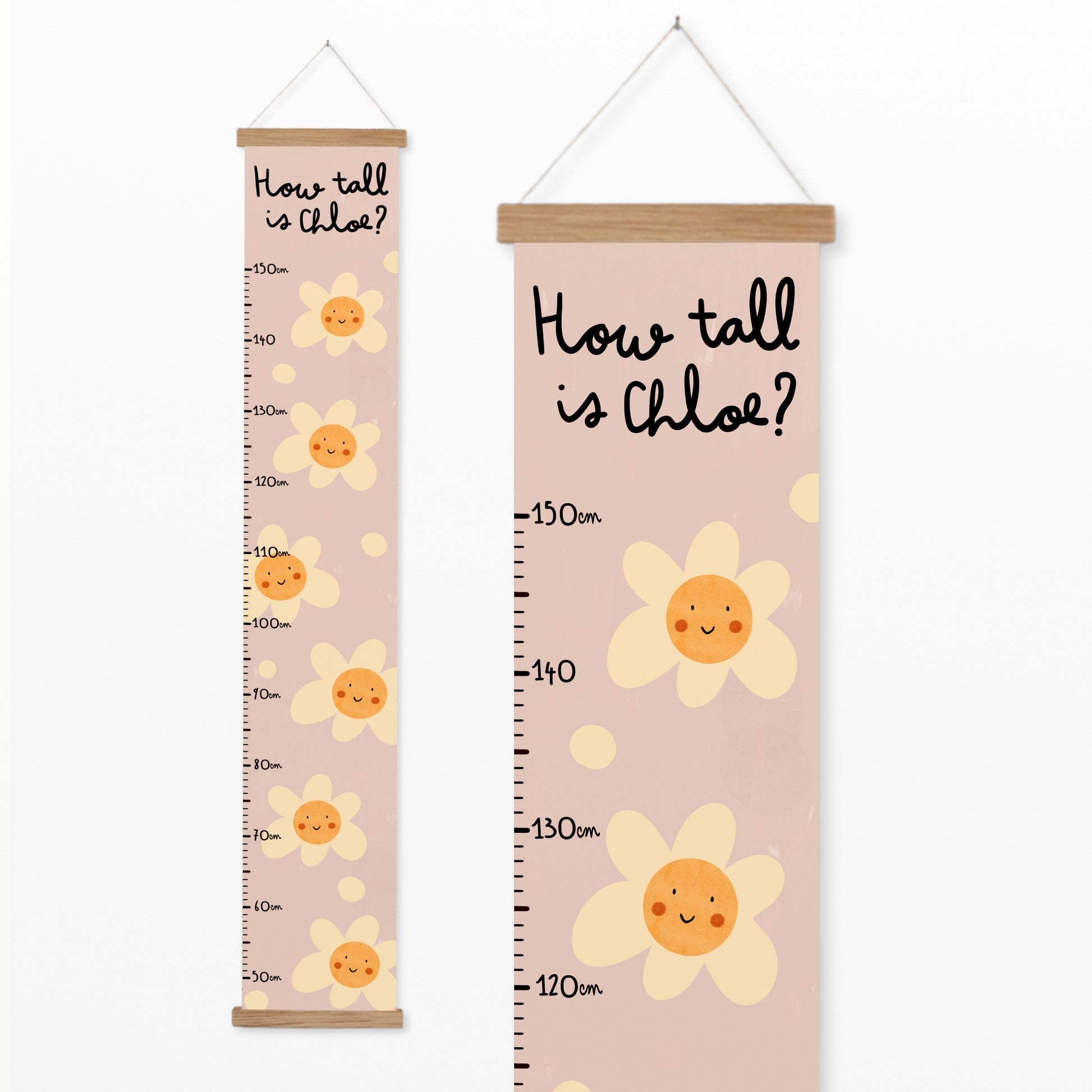 Pink personalised canvas height chart with smiling daisy flowers and "How tall is Chloe?" text, designed to measure child growth from 50 cm to 150 cm.