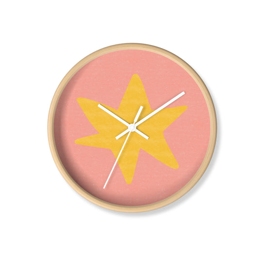 Round bamboo wall clock with hand-painted yellow star on a grey-blue background and white clock hands, perfect for nursery or playroom decor
