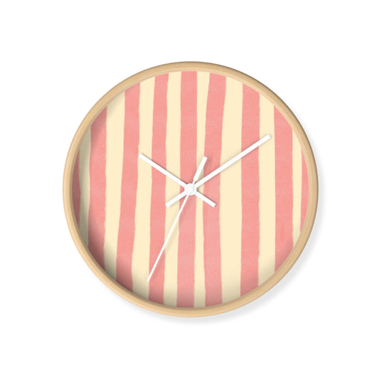 Scandi-style round wall clock with pink and beige stripes for neutral nursery decor