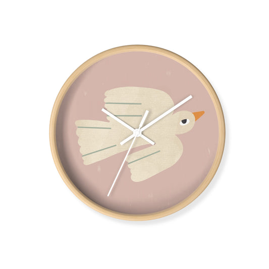 Wall clock with a bird design on a pink background