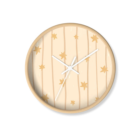 Round wall clock with star pattern on a beige background